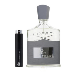 Fragrance product by Creed showing a clear glass Creed Aventus Cologne bottle with a grey textured base, silver horse and rider logo, and matching grey faceted cap, next to a black FragranceLord travel atomizer