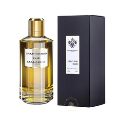 Product shot of Mancera Crazy For Oud perfume on a white background showing a clear bottle with golden liquid, a shiny gold cap, and a black rectangular box featuring the iris logo and "Mancera Paris" on its white label