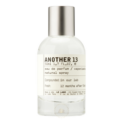 Le Labo Another 13 eau de parfum clear glass bottle with a brushed silver cap and a minimalist white label displaying the fragrance name and 50ml volume