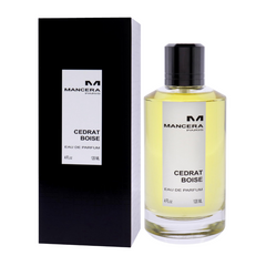 Product photography of Mancera Paris Cedrat Boise Eau de Parfum, featuring a clear glass bottle with light yellow liquid and a black cap next to its matching black box with a white label prominently displaying the brand, product name, and 120 ML volume