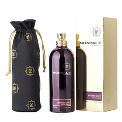 Commercial product photograph of Montale Intense Cafe perfume featuring a dark purple metallic 100ml bottle with a gold sprayer and cap, a black drawstring pouch adorned with gold Montale logos, and a gold retail box with purple text for Eau de Parfum