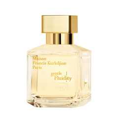 Product photograph of Maison Francis Kurkdjian Paris Gentle Fluidity perfume bottle, a clear faceted glass bottle containing pale yellow liquid, topped with a rectangular gold cap and adorned with gold lettering