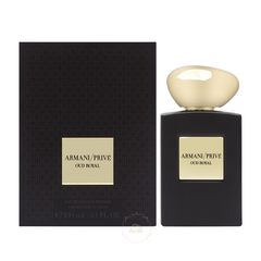 Armani/Privé Oud Royal perfume bottle and its matching rectangular box displayed on a white background, featuring a matte black bottle with a unique irregular glossy gold cap and a dark brown textured box both with central gold labels