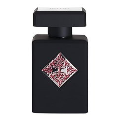 Initio Parfums Privés perfume bottle a matte black rectangular flask with a silver diamond emblem featuring ornate red filigree on its front and Initio text on the cap's white band