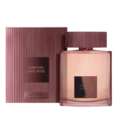 Product photography by Tom Ford of the Café Rose Eau de Parfum, a rose-toned fluted glass bottle with a matching ribbed box featuring black labels displaying Tom Ford Café Rose text
