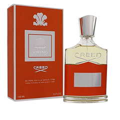 Creed Viking Cologne product image featuring a vibrant orange box with a silver Viking longship emblem and a coordinating fragrance bottle with a metallic silver cap and the Creed logo embossed on its clear upper half