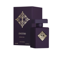 Initio Parfums Privés Atomic Rose Eau de Parfum 90 ml bottle and matching dark purple box featuring ornate gold diamond logos against a clean white background
