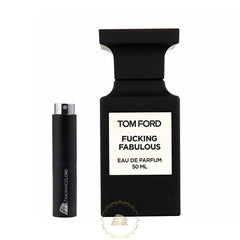 Product photograph of a black Tom Ford Fucking Fabulous 50ml Eau de Parfum bottle with its white label, positioned alongside a smaller black FRAGRANCELORD travel atomizer featuring a silver sprayer, all presented on a clean white background