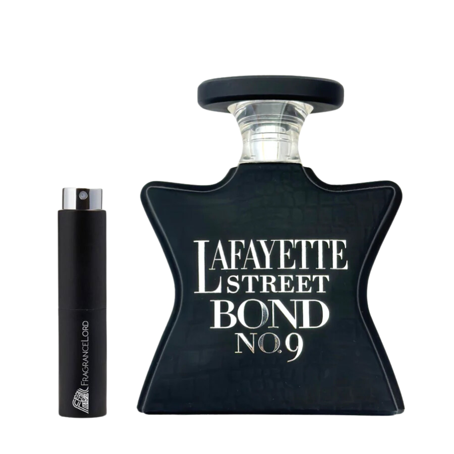Product photograph of a matte black star-shaped Bond No. 9 Lafayette Street perfume bottle with white lettering next to a slender black Fragrance Lord travel atomizer with a silver top