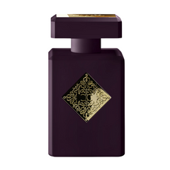 Product photograph by The Spirit of Dubai / The House of Oud showcasing a dark plum rectangular perfume bottle adorned with an ornate gold diamond-shaped logo and a gold cap