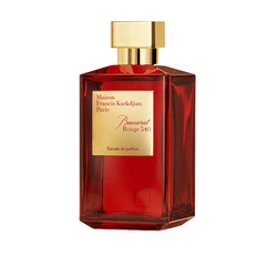 Maison Francis Kurkdjian Baccarat Rouge 540 Extrait de parfum perfume bottle isolated on white featuring a deep red faceted glass design a gleaming golden rectangular cap and a prominent gold label with the fragrance name and brand logo