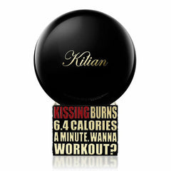 Product photograph by Kilian of a glossy black spherical perfume bottle featuring gold Kilian script and a rectangular black base displaying the red and white text Kissing Burns 6.4 Calories A Minute Wanna Workout