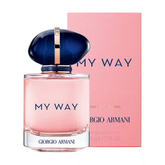 Product photography, Giorgio Armani My Way Eau de Parfum perfume bottle with light pink liquid and a distinct dark blue organic-shaped cap with rose gold detail, displayed alongside its matching pink branded box