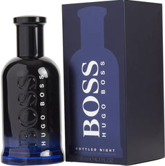 Hugo Boss Bottled Night cologne bottle with a glossy black to dark blue gradient and embossed white BOSS logo next to its matte dark blue box showing the brand name and 200 ml capacity