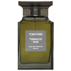 Product Photography by Tom Ford featuring a dark olive green glass bottle of Tobacco Oud Eau de Parfum with a dark bronze ribbed cap and a prominent grey label displaying "TOM FORD TOBACCO OUD EAU DE PARFUM 100 ML" in white text