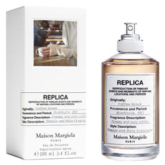 Maison Margiela Replica Coffee Break Eau de Toilette bottle and white box, featuring a transparent bottle with a minimalist fabric-like label detailing its creamy and cozy coffee scent from Stockholm 2007 and an inset photo of people holding coffee cups