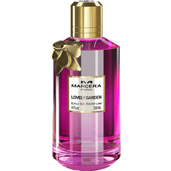 Product photography by Mancera Paris showing a Lovely Garden Eau de Parfum bottle from Paris with a shiny gold cap, decorative bow, and vibrant fuchsia pink liquid in a clear glass bottle