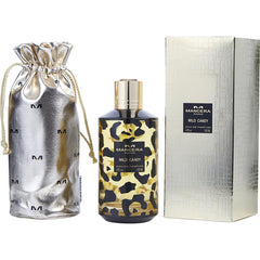 Mancera Paris product photography featuring Wild Candy Eau de Parfum in a distinctive leopard print bottle, accompanied by a shiny gold metallic pouch embossed with 'M' logos and a textured silver box