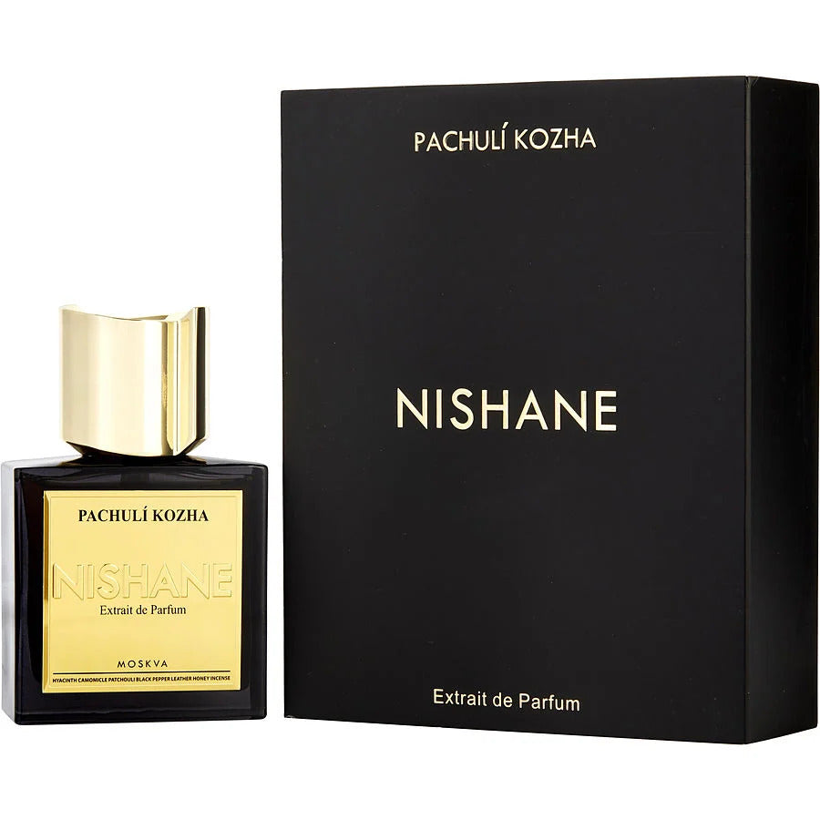 Nishane Pachulí Kozha Extrait de Parfum features a sleek black rectangular bottle with a gold label and cap displayed next to its matching black box with gold lettering, emphasizing its blend of patchouli, leather, and honey incense