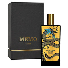 Memo Paris Winter Palace Eau de Parfum product photography features a black textured box with gold lettering next to a sleek black perfume bottle with a gold cap and an intricate gold and black Chinese dragon design detailed with vivid blue accents on its head and the name Winter Palace