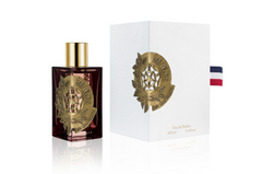 Etat Libre d'Orange 500 Years luxury perfume bottle and white box displaying a dark amber glass bottle with a gold cap and intricate gold medallion featuring a stylized rose, '500 YEARS' text, and a French tricolor ribbon detail