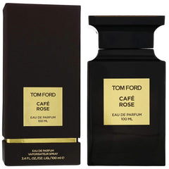Product photograph of Tom Ford Café Rose Eau de Parfum featuring a sleek black rectangular bottle and matching box, both with prominent gold labels displaying the fragrance name and 100ml volume