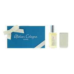 Atelier Cologne product photograph showing a gift set from Paris featuring a bright blue box with a white bow, a clear perfume bottle of Vanille Insensée, and a light beige leather travel case