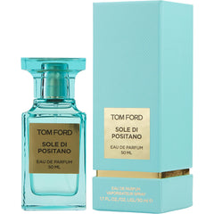 Photography by Tom Ford showcasing the Sole di Positano Eau de Parfum in a vibrant teal blue bottle with gold rectangular labels and its matching 50 ML rectangular box