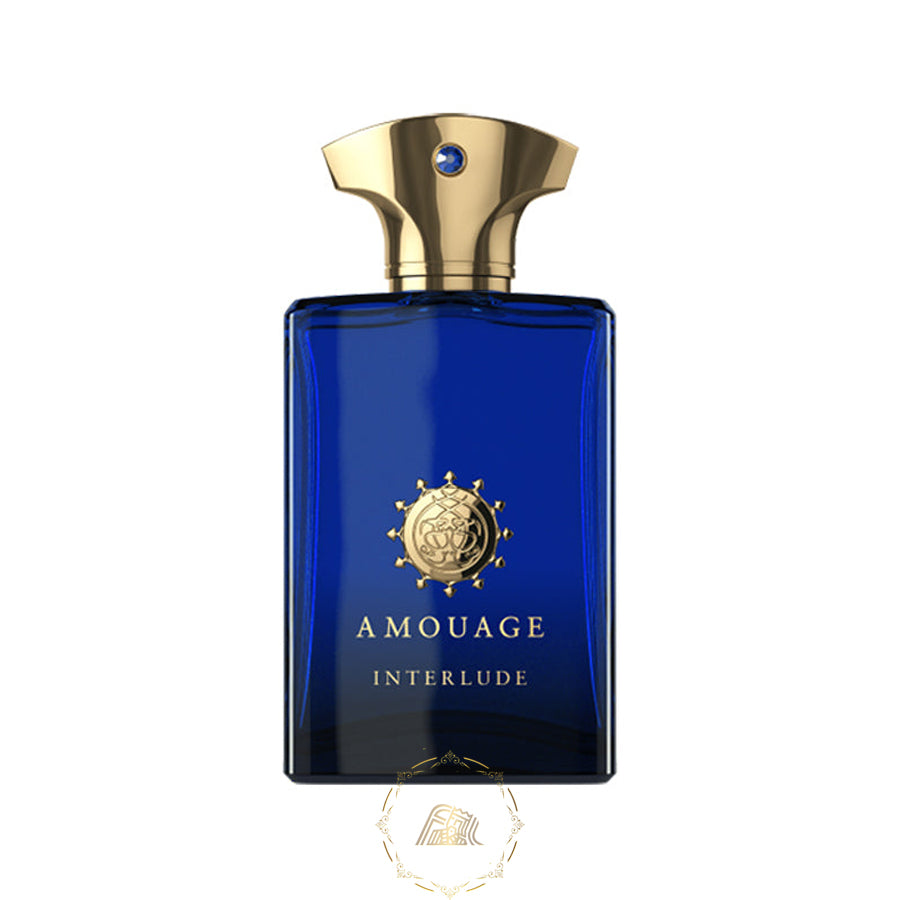 Product photography by Amouage depicting their Interlude fragrance bottle a distinctive deep blue rectangular glass vessel featuring an ornate gold cap with a sapphire gem and a gold Amouage emblem