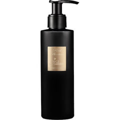 Kilian product, a tall matte black bottle of Black Phantom with a gold label featuring the brand name and MEMENTO MORI, topped with a black pump dispenser