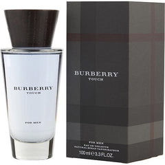 Burberry Touch For Men Eau de Toilette 100ml, a clear glass bottle with light blue liquid and dark wood cap displayed next to its dark gray box featuring a classic tonal Burberry plaid pattern