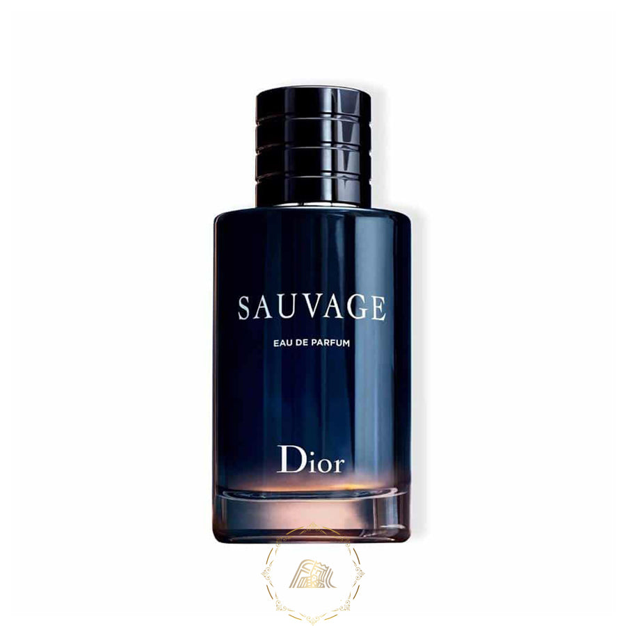Dior digital product photograph of a Sauvage Eau de Parfum bottle with a dark blue gradient glass, ribbed black magnetic cap, silver text, and amber glow at the base on a white background