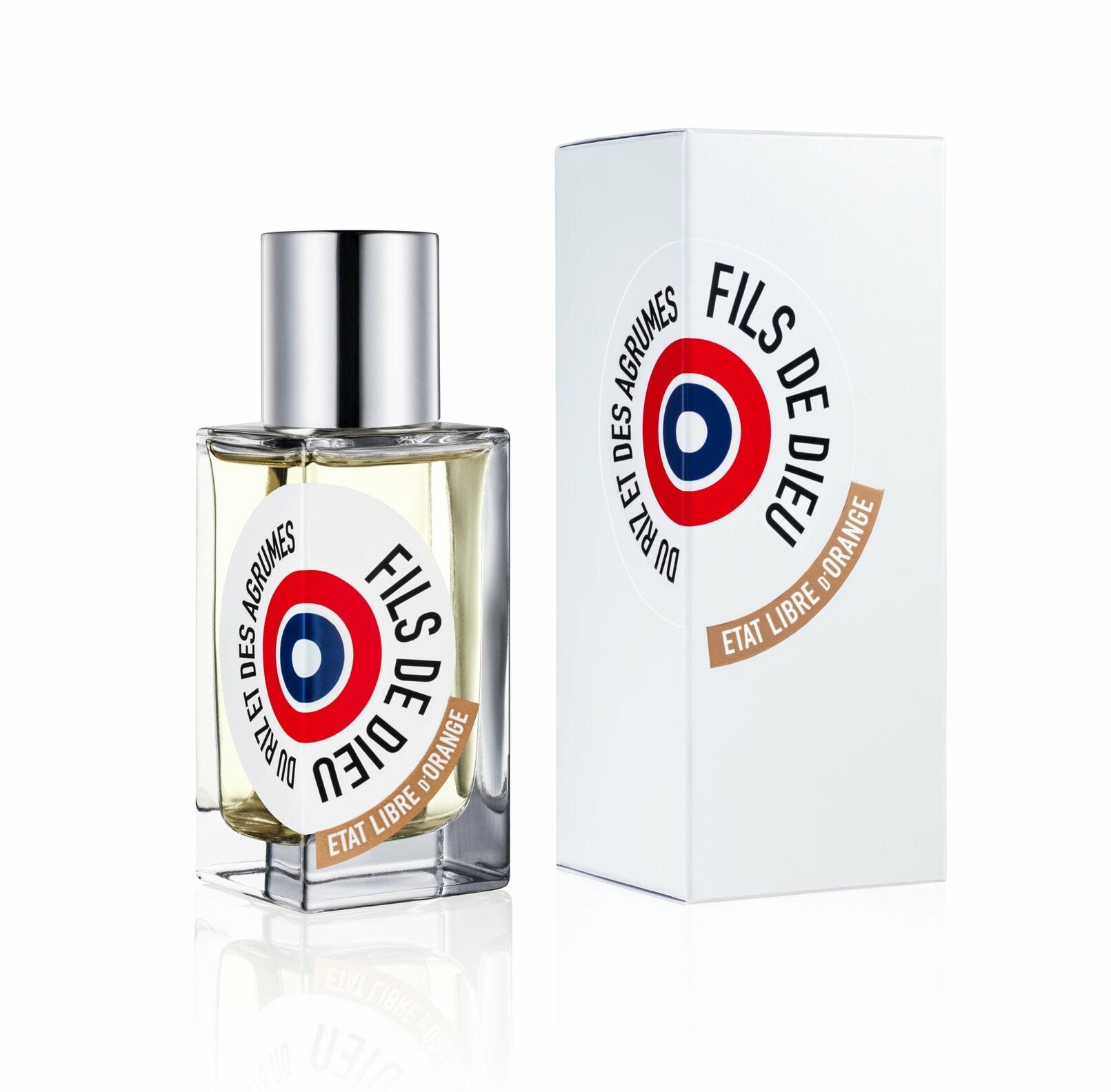 Product photo of an Etat Libre d'Orange Fils de Dieu perfume bottle with light yellow liquid, silver cap, and a white label featuring a red, white, and blue target emblem, displayed next to its matching white box on a reflective surface