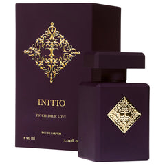 Product photography of the Initio Parfums Prives Psychedelic Love Eau de Parfum bottle and matching box in deep plum, featuring intricate gold ornate emblems and gold text displaying the name and volume e 90 ml 3.04 fl. oz on a clean white background
