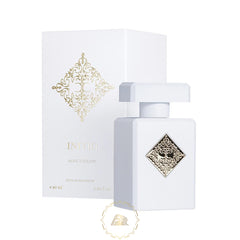 A white rectangular Initio Parfums Privés Musk Therapy Extrait de Parfum perfume bottle and box featuring an ornate gold diamond emblem