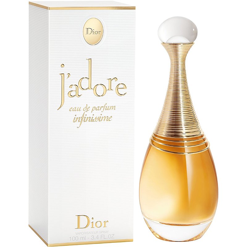 Product photography of Dior J'adore Infinissime Eau de Parfum with its iconic amphora-shaped bottle featuring a golden ribbed collar and clear pearl-like cap standing next to the white textured box with elegant gold lettering