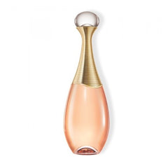 Product photography by Dior of a J'adore perfume bottle, featuring a clear spherical cap, a slender neck wrapped in gilded rings, and pale amber liquid in its elegant teardrop form