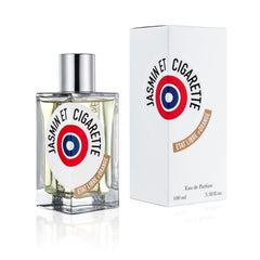 Product Photography of an Etat Libre d'Orange Jasmin et Cigarette perfume bottle and white box on a clean white background, showcasing a clear rectangular bottle with a silver cap, a bold white label featuring a red, white, and blue target logo, and a brown Etat Libre d'Orange brand ribbon detail