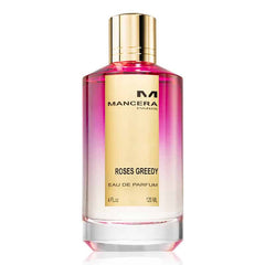 Product photography, Mancera Roses Greedy Eau de Parfum bottle featuring a pink to clear gradient liquid, a reflective gold cap, and a gold label displaying Mancera Paris and Roses Greedy text