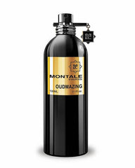 Montale OUDMAZING perfume in a sleek black bottle with a prominent gold label displaying the name, featuring a silver sprayer and a unique M logo charm