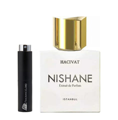 A white rectangular Nishane Hacivat Extrait de Parfum bottle with a shiny golden geometric cap from Istanbul stands next to a tall black cylindrical FragranceLord decant spray bottle