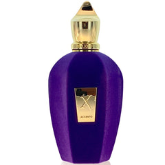 Photograph of a Xerjoff Accento perfume bottle featuring a faceted vibrant purple design an ornate gold spire cap and a prominent gold X logo