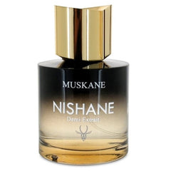Product photography of a Nishane Muskan Demi Extrait fragrance bottle featuring a glossy gold cap and a distinct black-to-gold gradient glass with a subtle deer head logo