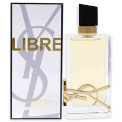 Product photograph of Yves Saint Laurent Libre Eau de Parfum featuring a clear rectangular bottle with a prominent gold YSL logo, a black asymmetric cap with gold chain detail, and a white box with bold gold LIBRE lettering