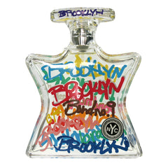 Bond No. 9 Brooklyn fragrance in an iconic star-shaped clear glass bottle, celebrating Brooklyn, New York City, through vibrant multi-colored graffiti-style lettering spelling 'Brooklyn' and 'Bond No. 9' in hues of red, blue, and yellow, alongside its distinctive circular NYC logo