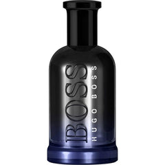 Product photograph of a sleek Hugo Boss BOSS perfume bottle featuring a black to deep blue gradient, prominent embossed dark metallic "BOSS" text, and smaller vertical "HUGO BOSS" lettering