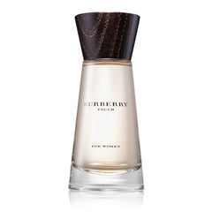 Product photography of a Burberry Touch For Women perfume bottle, featuring a clear tapered glass with pale amber liquid and a dark textured wooden cap, isolated on a white background