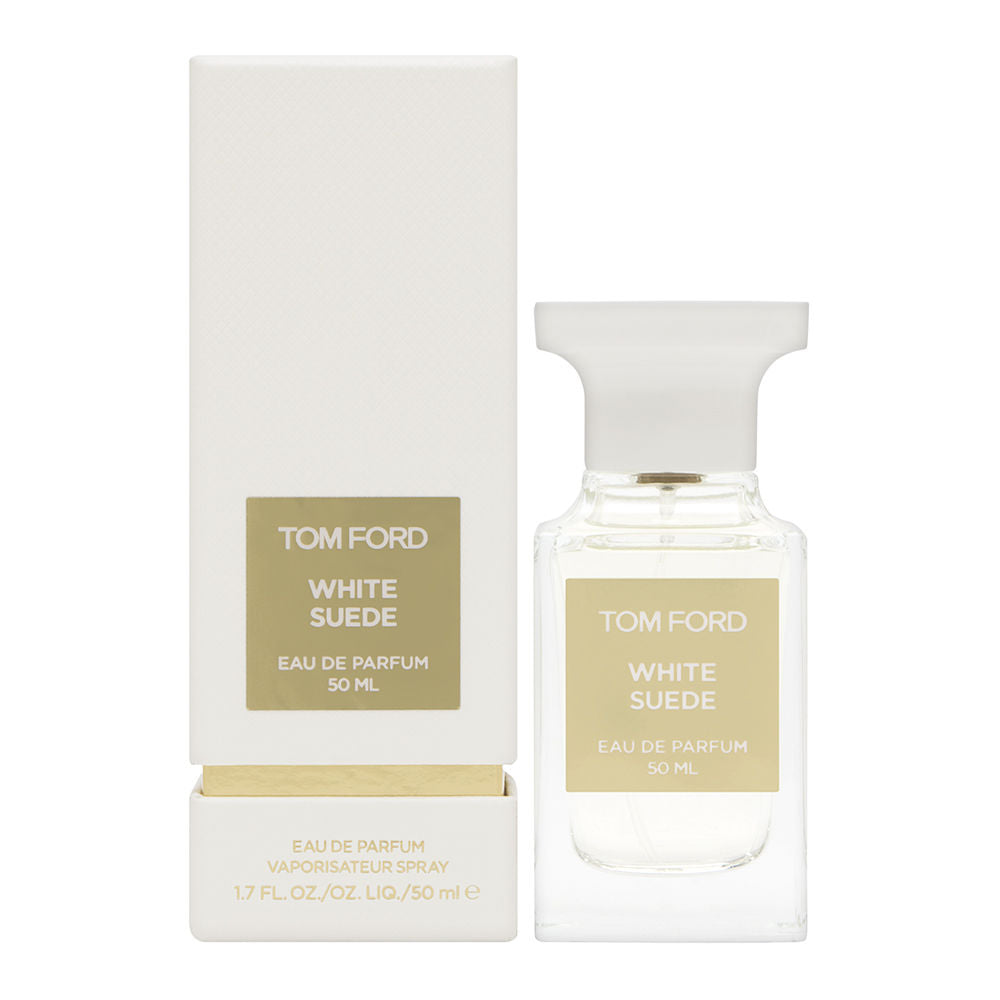 Product photography by Tom Ford of White Suede Eau de Parfum 50 ml, featuring a clear glass bottle with white cap and a white rectangular box, both displaying gold text labels