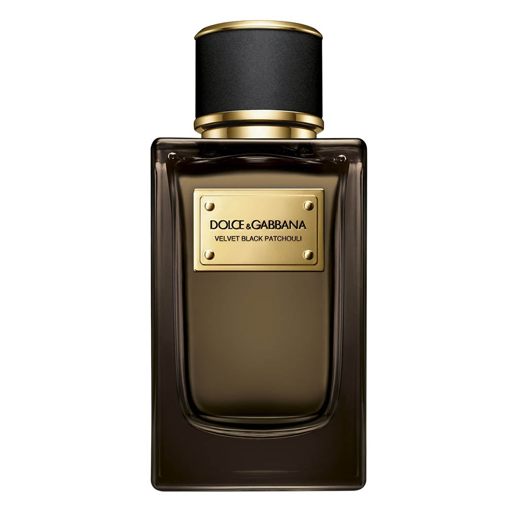 Digital photograph of Dolce & Gabbana Velvet Black Patchouli perfume bottle, a dark rectangular glass bottle with a black and gold cap, and a gold label displaying the product name with small gold rivets