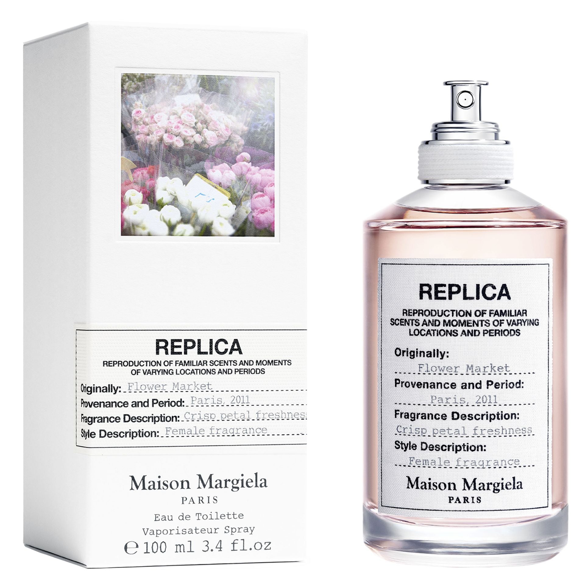 Maison Margiela Replica Flower Market Eau de Toilette product photo, showing a white box with a window displaying pink and white floral bouquets and a clear perfume bottle with pale pink liquid, a cotton-wrapped cap, and label text indicating its Paris 2011 inspiration and crisp petal freshness